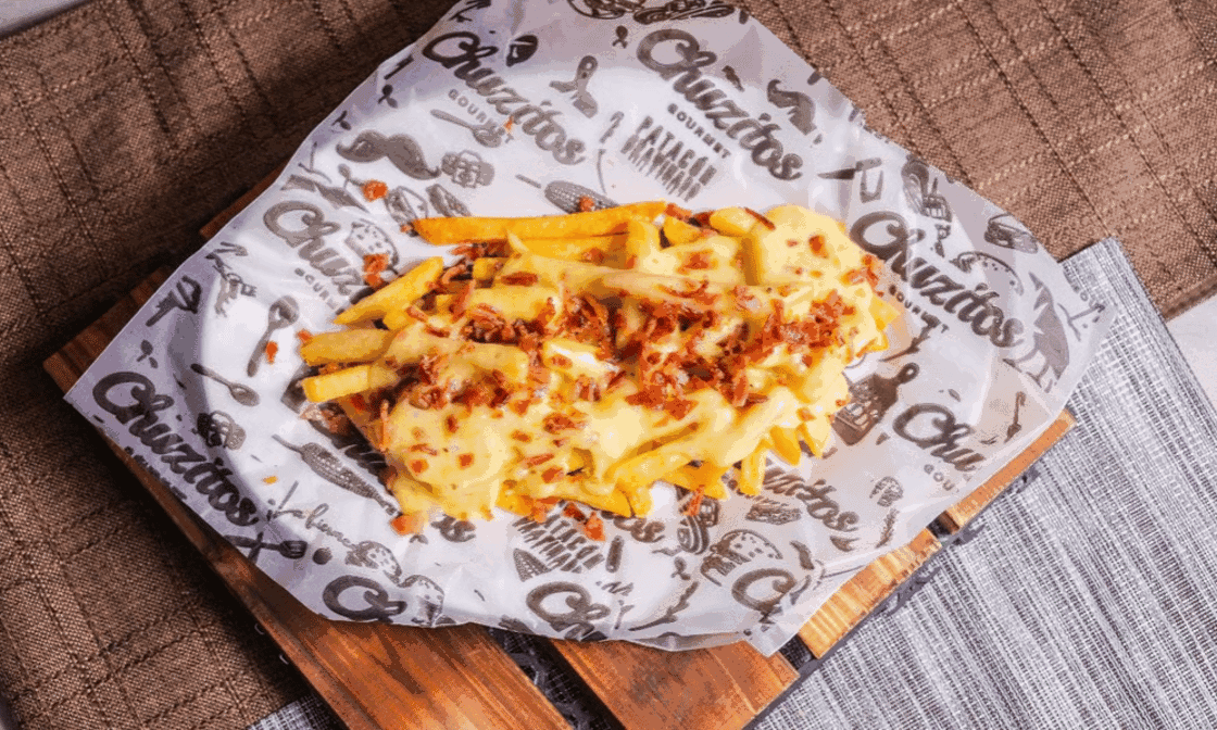 French Fries Au Gratin With Bacon - Crispy french fries topped with melted cheese and savory bacon.